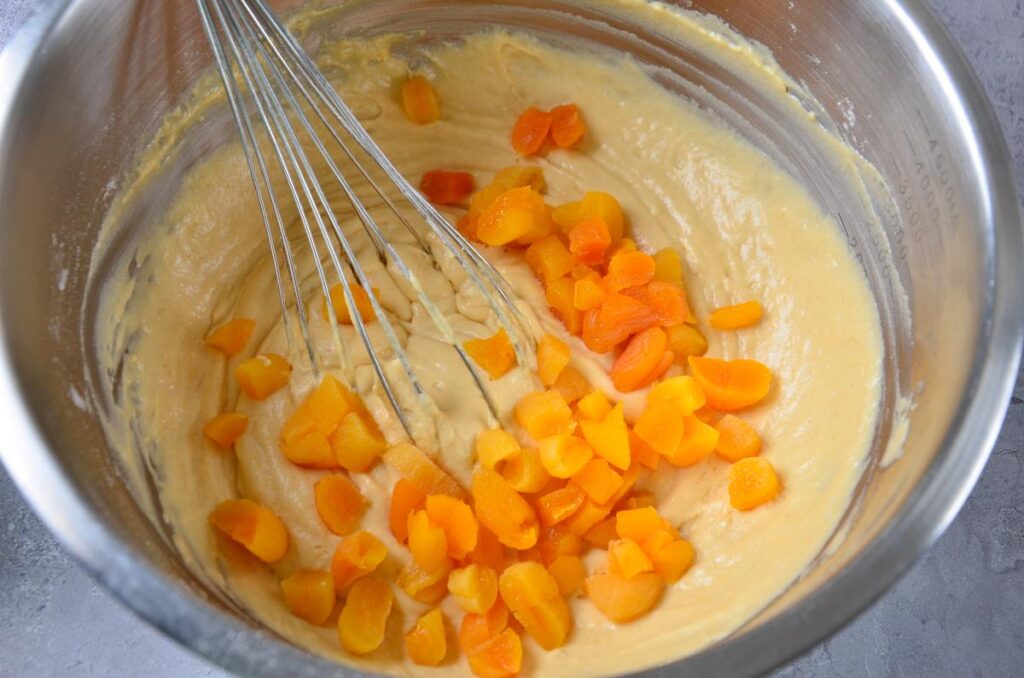 Adding the apricots to the batter