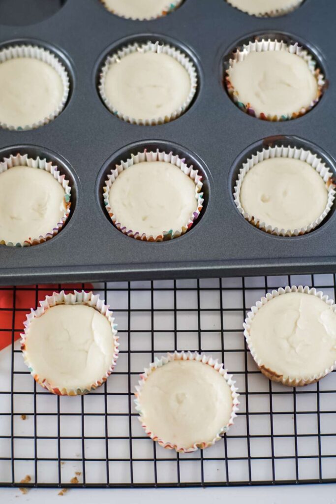 Fill each cupcake liner with the prepared cream cheese mixture.