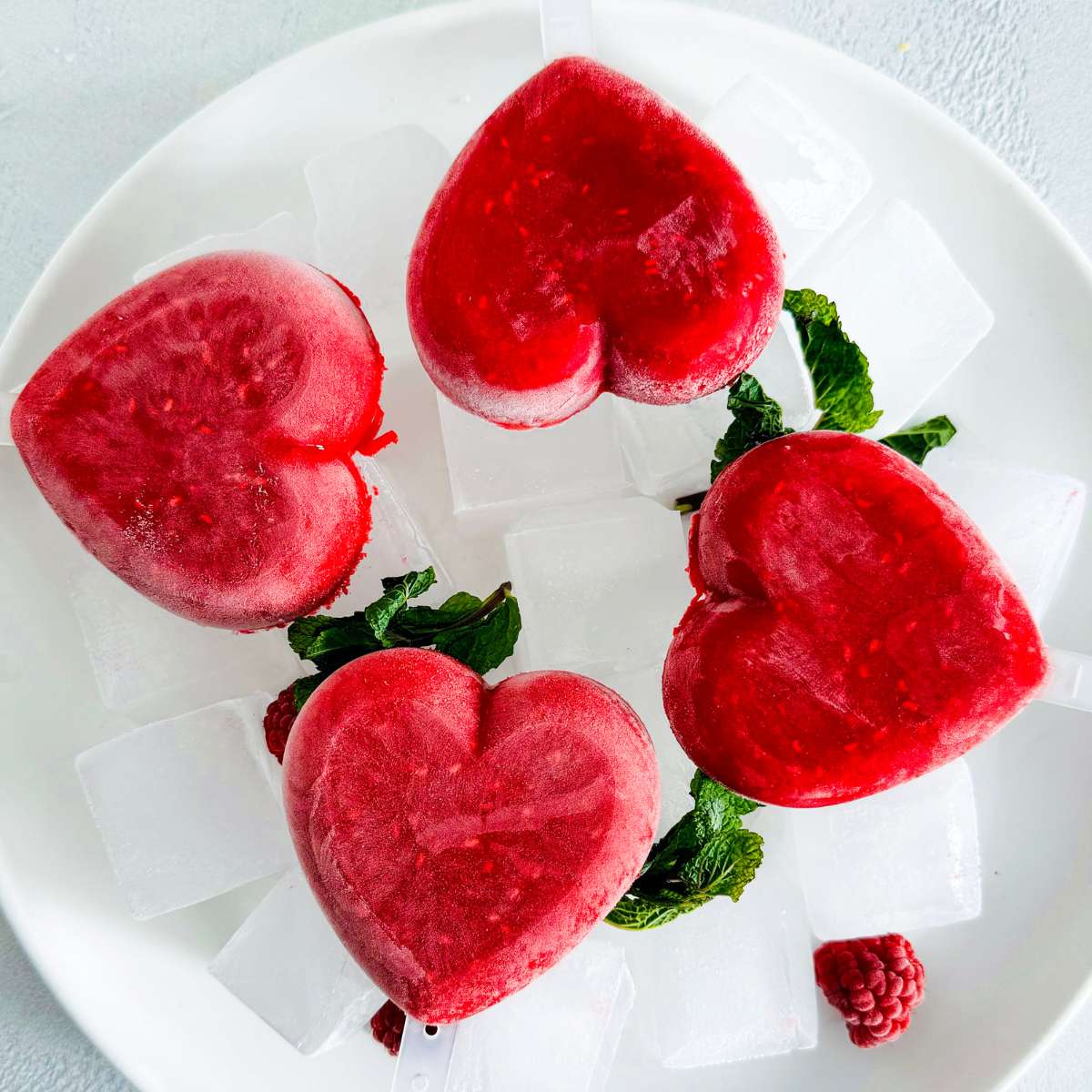 Easy Two-Ingredient Raspberry Popsicles - nicetartes.com