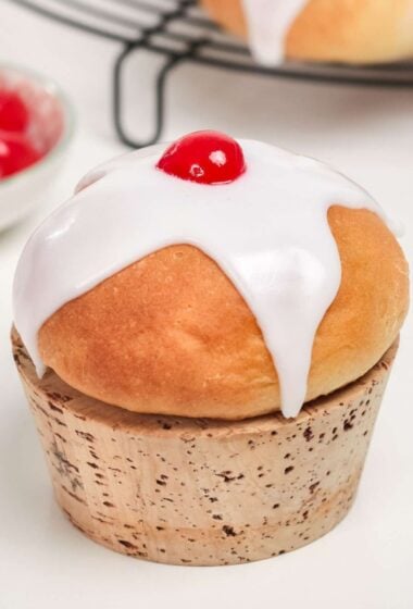 a ice roll with a white frosting on top