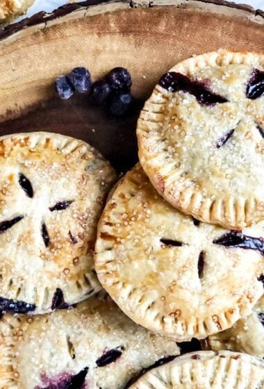 a plate of blueberry pies