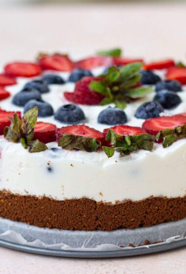 a Frozen Lemonade Pie with strawberries and blueberries on top