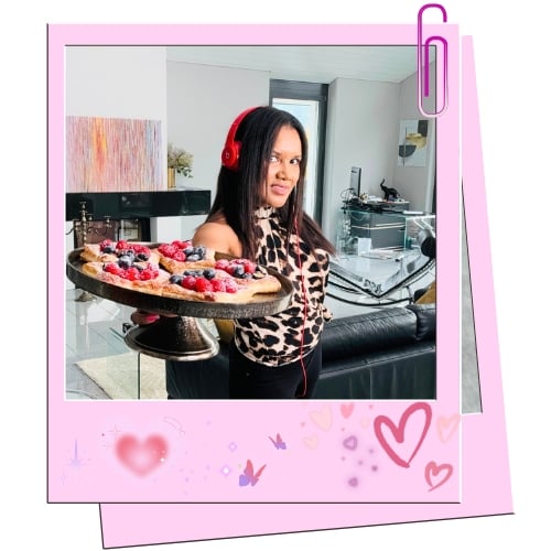 Keesha holding a deliciouse pastry.